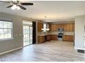 Kitchen with wooden cabinets, stainless steel appliances, and hardwood floors at 112 Ryder Cup Cir, Raleigh, NC 27603