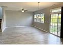 Spacious living room with hardwood floors and sliding glass door at 112 Ryder Cup Cir, Raleigh, NC 27603