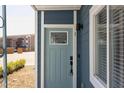 Light blue front door with keyless entry and sidelight window at 1309 Hudson Ave # A7, Durham, NC 27705