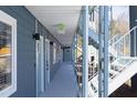 Clean and well-lit hallway with exterior access and fire escape at 1309 Hudson Ave # A7, Durham, NC 27705
