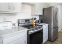 Modern kitchen with stainless steel appliances at 1416 Chambers Rd, Rougemont, NC 27572