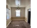 Bright dining area featuring a chandelier and neutral color scheme at 1017 Long Ave, Rocky Mount, NC 27801