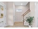Light-filled entryway with stairs leading to the upper level at 1917 A Essex, Durham, NC 27704