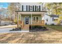 Two-story house with front porch and wooden stairs at 1917 B Essex Rd, Durham, NC 27704