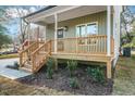 House exterior showcasing a porch with wooden railings at 1917 B Essex Rd, Durham, NC 27704