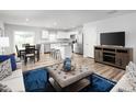 Open concept kitchen and dining area with stainless steel appliances at 218 Elyse Overlook Loop, Sanford, NC 27332