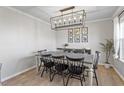 Dining room with a modern chandelier and farmhouse-style table at 235 N Fuquay Springs Ave, Fuquay Varina, NC 27526