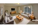 Virtually staged living room with modern furniture at 311 Burnette St, Durham, NC 27707