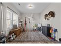 Charming play room with a large rug and plenty of space for toys at 38 Hiddenbrook Ct, Angier, NC 27501