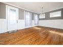 Formal dining room with hardwood floors, wainscoting, and chandelier at 503 Bendemeer Ln, Rolesville, NC 27571