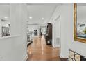 Hallway view of kitchen with hardwood floors at 5503 Rutherford Close, Pittsboro, NC 27312