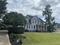 Two-story house with blue siding, black shutters, and a landscaped yard at 7513 Orchard Crest Ct, Apex, NC 27539