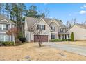 Two-story house with brown accents and a landscaped lawn at 8916 Buffalo Gourd Ln, Angier, NC 27501