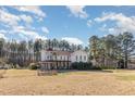 House nestled on a spacious lot with mature trees surrounding at 105 Kingfisher Way, Louisburg, NC 27549