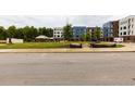 Apartment building exterior with parking and green space at 2204 Gathering Square Ct, Fuquay Varina, NC 27526