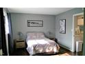 Cozy bedroom with a double bed, nightstands, and hardwood floors at 807 W Trinity Ave # 241, Durham, NC 27701