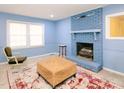 Living room with fireplace and two armchairs at 1354 Mudham Rd, Wendell, NC 27591