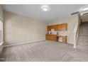 Spacious basement recreation area with wet bar and built-in cabinetry at 1674 Snowmass Way, Durham, NC 27713