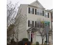Two-story townhome with neutral siding and a front-facing garage at 1674 Snowmass Way, Durham, NC 27713