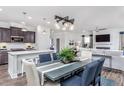 Bright dining room with a large concrete table and comfortable seating at 47 Rosedale Way, Pittsboro, NC 27312