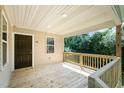 Charming front porch with wooden railings and a view of the trees at 722 Martin St, Durham, NC 27704