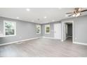 Bright and spacious living room with gray walls and wood-look floors at 722 Martin St, Durham, NC 27704