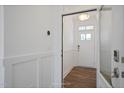Bright entryway with hardwood floors and a modern door at 1817 Ballard Rd # Selma English Country, Fuquay Varina, NC 27526
