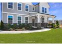 Gray siding two-story house with stone accents and a walkway at 1817 Ballard Rd # Selma English Country, Fuquay Varina, NC 27526