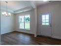 Bright dining room with hardwood floors and chandelier at 6100 Sunset Lake Road Rd, Fuquay Varina, NC 27526