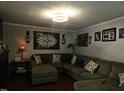 Spacious living room with L-shaped sectional sofa at 805 Worth Hinton Rd, Zebulon, NC 27597