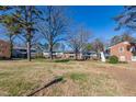 Apartment building nestled among mature trees, showcasing a tranquil setting at 817 Daniels # B, Raleigh, NC 27605