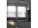 Simple kitchen with double sink and white cabinets at 1631 Granville St, Burlington, NC 27215