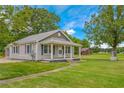 Ranch home with metal roof and spacious yard, plus a barn at 1152 Pagetown Rd, Elon, NC 27244