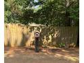 Mailbox in a landscaped area with a wooden fence at 7055 Old Plantation Dr, Graham, NC 27253