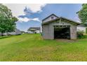 Detached garage with open door, revealing tools and equipment at 4470 S Nc Highway 62, Burlington, NC 27215