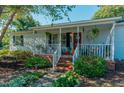 Front view of a charming white mobile home at 4941 Rumley Rd, Graham, NC 27253