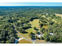 Aerial view of property showing home and surrounding land at 4941 Rumley Rd, Graham, NC 27253