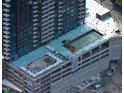 Aerial view of a modern high-rise building under construction in an urban setting at 400 W Main St # 2403, Durham, NC 27701