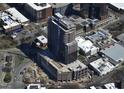 Aerial view of a modern high rise building under construction in a city setting at 400 W Main St # 2404, Durham, NC 27701