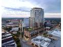 Aerial view of a luxury highrise building with rooftop amenities at dusk at 400 W Main St # 2001, Durham, NC 27701
