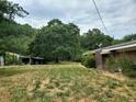 Large yard with shed and brick house at 899 Pittman Ln, Micro, NC 27555