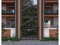 Modern apartment building entryway with glass doors at 600 N Roxboro St # 44, Durham, NC 27701