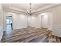 Bright dining room with hardwood floors and chandelier at 120 Ironwood Blvd # Gh 29, Youngsville, NC 27596
