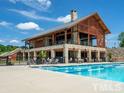 Resort-style pool with expansive deck and clubhouse at 129 Noble Deer Way, Wendell, NC 27591