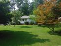 Ranch home with a spacious lawn and mature trees at 3418 Leonard St, Raleigh, NC 27607