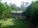 Rear view of the house, showing a backdoor and yard at 3418 Leonard St, Raleigh, NC 27607