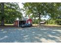 Red barn and additional storage building on property at 10782 S Nc 62 Hwy, Burlington, NC 27217