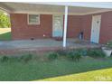 Brick patio with access from the house and small plants at 2164 Ray Rd, Spring Lake, NC 28390