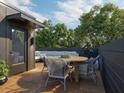 Private rooftop deck with modern patio furniture and city views at 700 Chatham View Rd # 10, Cary, NC 27511