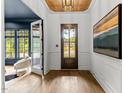 Bright entryway with hardwood floors and art at 5307 Dixon Dr, Raleigh, NC 27609